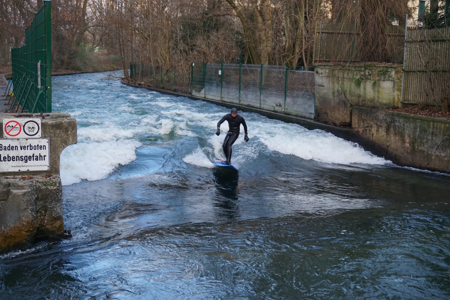 Surfer on Eisbach in the Englischer Garten - Munich
